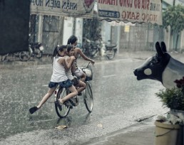 girls cycling in the rain elsewhere blog image