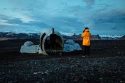 plane wreck with person in yellow jacket